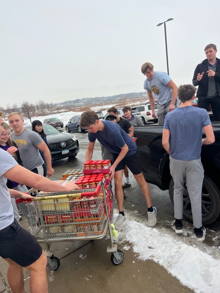 Volunteers loading groceries for delivery
